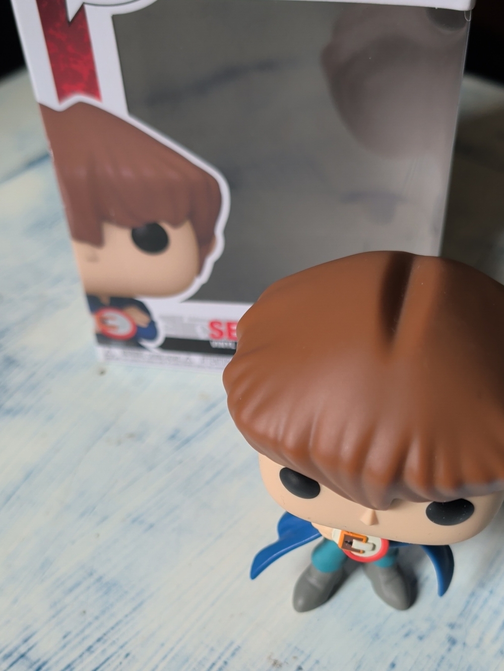 Funko Brown-Haired Collectible Figure with Blue Cape